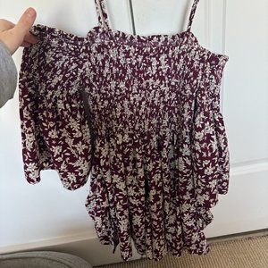 Maroon romper with white flowers